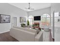 Bright living room with a fireplace, high ceilings, lots of natural light and neutral décor at 46 Centerport Dr, White, GA 30184