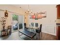 A dining room with modern bench seating, and sliding glass doors to the backyard patio at 780 Nehemiah Sw Ln, Atlanta, GA 30331