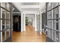 Grand foyer with hardwood floors, soaring ceilings, and elegant columns creates a striking first impression at 1860 Hill Chase, Alpharetta, GA 30022