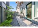 A cozy outdoor patio with a seating area, decorative gravel, and access to the main entrance at 260 2Nd St, Fayetteville, GA 30214