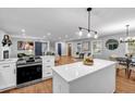 Open concept kitchen with quartz counters, stainless appliances, and easy access to the living room at 2921 Country Squire Ln, Decatur, GA 30033