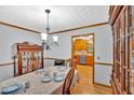 Traditional dining room featuring hardwood floors, detailed molding, and classic furnishings for elegant meals at 40 Picketts Forge W Dr, Acworth, GA 30101