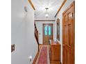 Welcoming entryway with hardwood floors, a decorative rug, and traditional wood accents at 40 Picketts Forge W Dr, Acworth, GA 30101