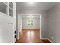 Inviting entryway with hardwood floors leading into the home's spacious interior at 215 Truehedge Trce, Roswell, GA 30076