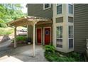 Exterior entrance showcasing the covered entryway, brick facade and beautiful plants at 607 Riverview Se Dr # 607, Marietta, GA 30067