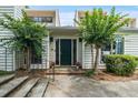 Inviting entrance to a home, with an attractive front door, landscaping, and charming curb appeal at 663 Serramonte Dr, Marietta, GA 30068