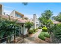 Scenic walkway through a residential community, featuring well-maintained exteriors and lush greenery at 663 Serramonte Dr, Marietta, GA 30068