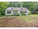 Cozy one-story home featuring classic architecture and a lush, tree-filled yard at 1774 Willis Mill Rd, Atlanta, GA 30311