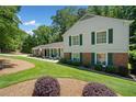 Lovely home with a well-maintained lawn, and green shutters on the exterior at 237 Lamplighter Ln, Marietta, GA 30067