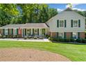 Charming two-story home with manicured lawn, walkway, and green shutters at 237 Lamplighter Ln, Marietta, GA 30067
