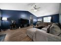 Comfortable living room with wood floors and a large sectional sofa at 74 Knights Ct, Dallas, GA 30157