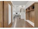Inviting foyer with hardwood floors, coat rack, and views into the living and dining areas at 267 Snow Owl Way, Lawrenceville, GA 30044