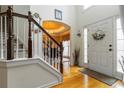 Bright foyer with hardwood floors, a staircase, and a front door with sidelights at 3780 Summit Gate Dr, Suwanee, GA 30024