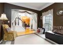 Cozy living room with natural light and view to foyer and staircase at 3780 Summit Gate Dr, Suwanee, GA 30024