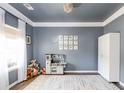 Bright playroom featuring gray accent walls, white trim, lots of toys, and a playful rug at 327 Nobleman Way, Canton, GA 30114