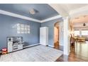 Cozy playroom area with white trim, blue walls, unique chandelier, and an open layout at 327 Nobleman Way, Canton, GA 30114