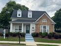 Charming home featuring a stone facade, landscaped front yard, and inviting entrance, perfect for curb appeal at 636 Lantern Park Ln, Scottdale, GA 30079