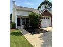 Inviting home exterior with a front yard, driveway, and single car garage, offering curb appeal at 1822 Commonwealth Dr, Woodstock, GA 30188