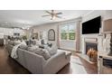 Inviting living room with a cozy fireplace, large sectional sofa, and open concept design for easy living at 2127 Apple Orchard Way, Austell, GA 30168