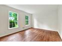 Bright bedroom with hardwood floors and large windows offering natural light at 3564 Liberty Ln, Marietta, GA 30062