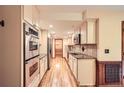 Bright eat-in kitchen with stainless steel appliances, granite countertops, and hardwood floors at 421 Fond Du Lac Dr, Stone Mountain, GA 30088