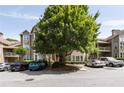 Apartment complex showcasing mature landscaping, multiple levels, covered patios and ample parking at 123 Mcgill Park Ave # 123, Atlanta, GA 30312