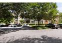 Apartment building shows covered patios, mature trees, ample parking and well maintained grounds at 123 Mcgill Park Ave # 123, Atlanta, GA 30312