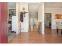 Inviting hallway with hardwood floors, leading to various rooms in the home, including the dining area at 474 Boxelder Rd, Atlanta, GA 30349