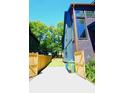 A long driveway with wooden fences and a view of the side of the house at 1122 Rice Nw St, Atlanta, GA 30318