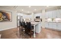 Open kitchen with white cabinets, granite countertops, stainless steel appliances, and a central island at 84 Cedarcrest Village Ln, Acworth, GA 30101