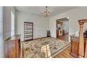 Formal dining room with a large area rug and a view into the kitchen area at 1942 Westover Nw Ln, Kennesaw, GA 30152