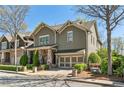 Craftsman-style home featuring stone accents, a well-maintained lawn, and a two car garage at 4541 Gateway Se Ct, Smyrna, GA 30080