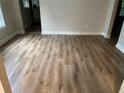 Inviting living room showcasing beautiful wood floors and fresh paint at 1829 Mercer, College Park, GA 30152