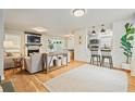 Bright living room featuring wood floors, shiplap accent wall, fireplace, and an open layout perfect for entertaining at 4120 Valley Wood Nw Dr, Marietta, GA 30064