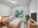 Comfortable bedroom with a large window providing natural light, complemented by soft, neutral tones at 6100 Semaphore Rdg, Rex, GA 30273