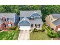 Beautiful home with landscaped front yard and inviting front porch at 1536 Fenmore St, Lithia Springs, GA 30122