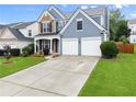 Beautiful two-story home with a well-maintained lawn, a two-car garage, and an inviting entrance at 2530 Vistoria Dr, Cumming, GA 30041