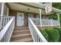 Inviting front porch featuring stylish railing and a charming space to sit and relax at 123 Mill Ln, Dallas, GA 30157