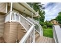 Inviting front porch with white railing and stairs leading to the front door at 123 Mill Ln, Dallas, GA 30157