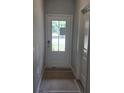 View of white front door with glass and side door at 2812 Lillian Ln, Douglasville, GA 30135