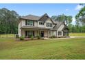 Charming two-story home with a landscaped yard and a welcoming front porch at 337 Paynes Lake Rd, Carrollton, GA 30116