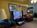 View of the living room showcasing decor, furnishings, and a TV at 2800 Browntown Nw Rd, Atlanta, GA 30318