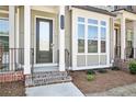 The well-maintained townhome showcases brick steps and a decorative porch at 3313 Park Pointe Cir, Scottdale, GA 30079