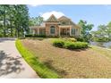 Attractive home featuring manicured lawn and well-maintained landscaping at 7815 Bamby Rd, Cumming, GA 30041