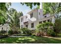 Beautiful home with a manicured lawn and mature trees at 820 Highland Ne Ter, Atlanta, GA 30306