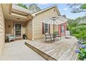 Inviting front porch with seating and a decorative entrance at 117 Laguna Springs Dr, Woodstock, GA 30188