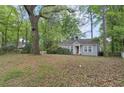 Cozy single-story home with a charming yard and mature trees providing shade at 2505 Mellville Ave, Decatur, GA 30032
