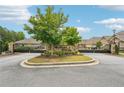 Stone entrance to Westbrook Village with gated access and manicured landscaping at 332 Rosshandler Rd, Suwanee, GA 30024