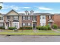 Well-maintained townhomes with brick facades, lush greenery, and appealing curb appeal at 4713 Liberty Square Dr, Acworth, GA 30101