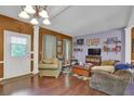 Inviting living room with hardwood floors, colorful walls, and ample natural light at 1003 Dunedin Trl, Woodstock, GA 30188